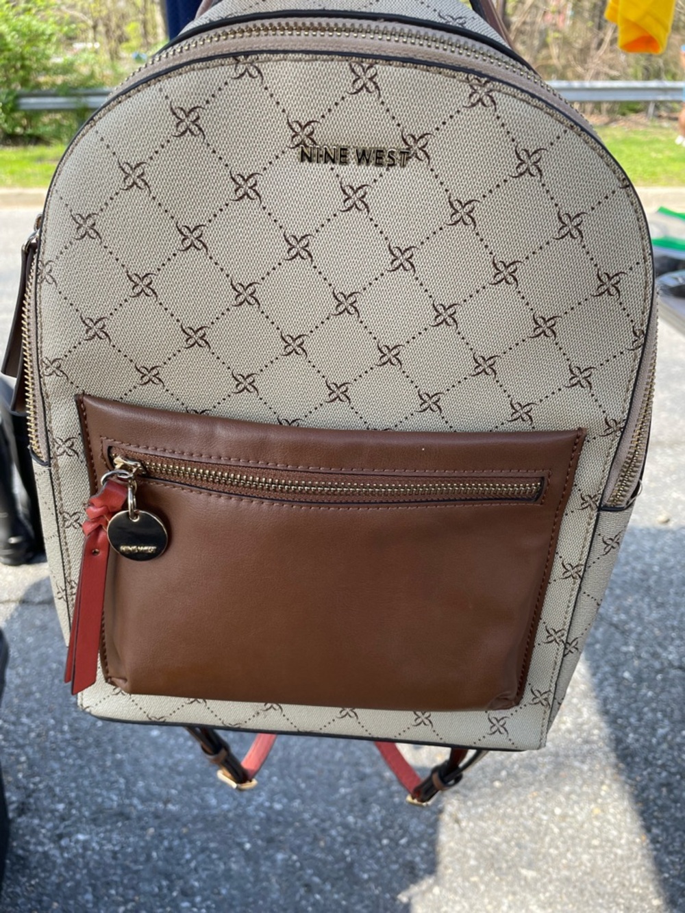 Nine West Beige Logo Backpack with Brown Front Pocket and Red Accent